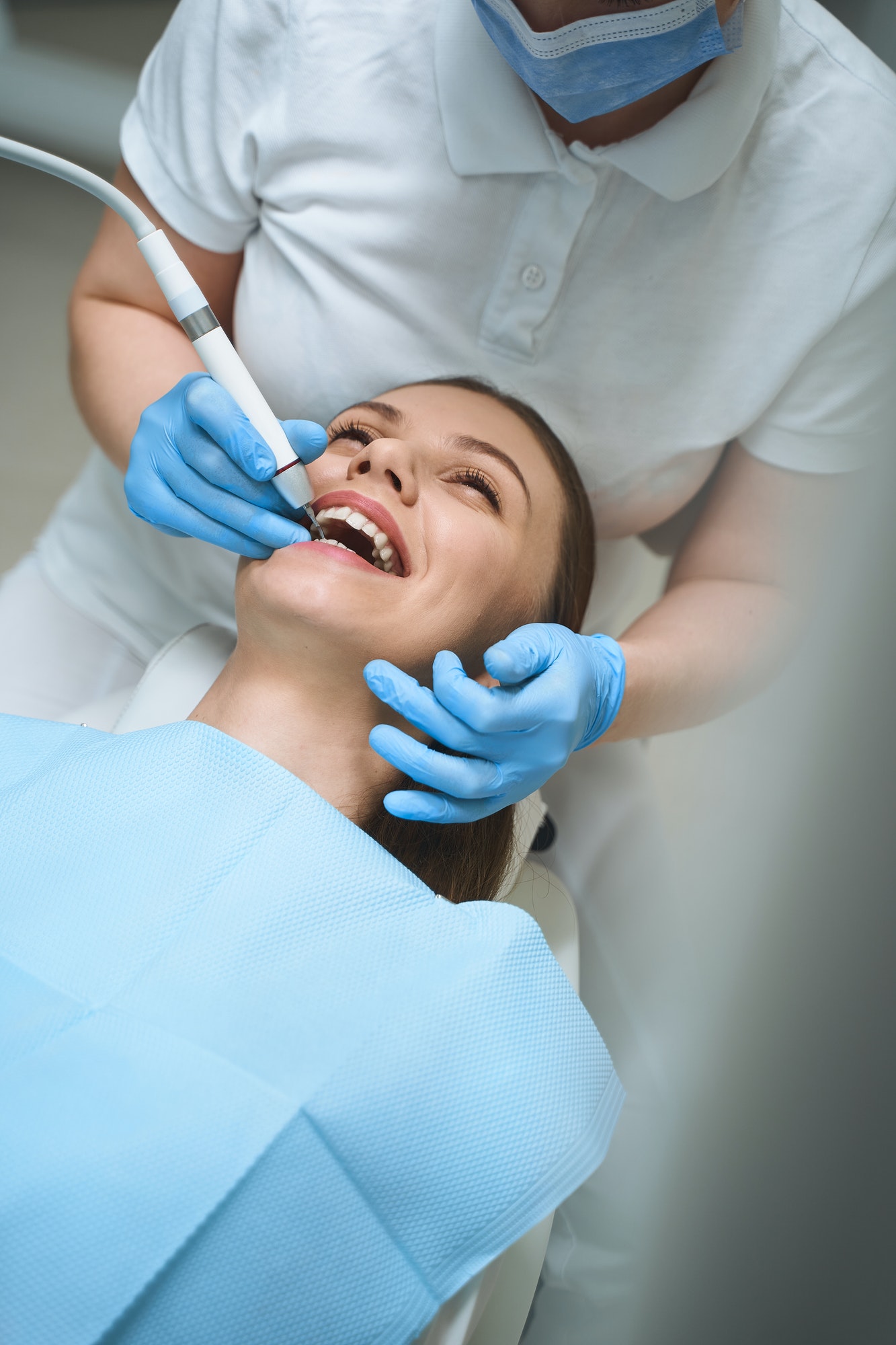 Cheerful young woman at dentist stock photo